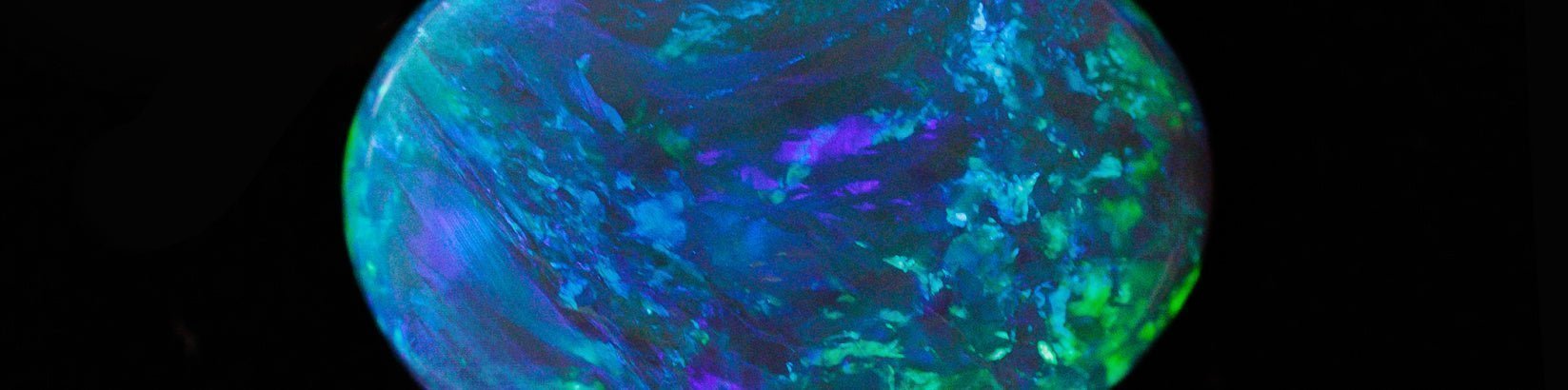 An October opal birthstone from Lightning Ridge in Australia that is blue and green in colour.