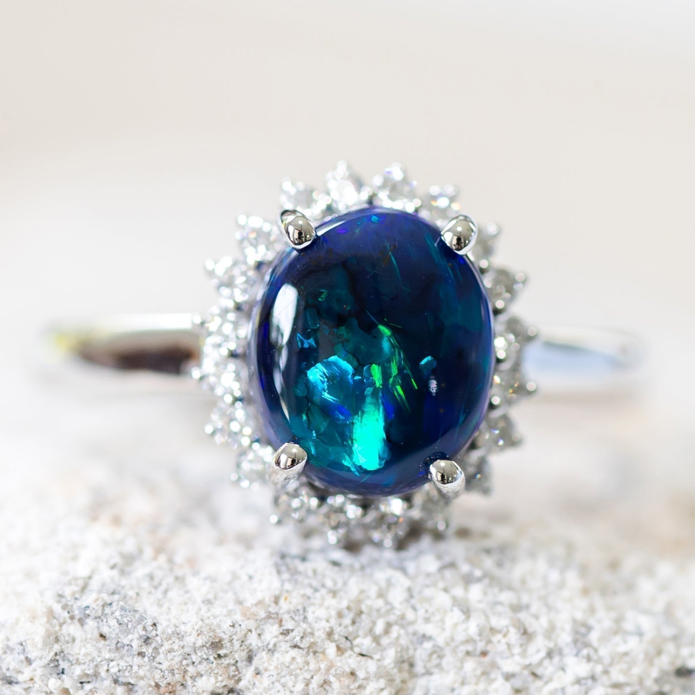 Black opal ring set in 18ct white gold with diamonds by Black Star Opal
