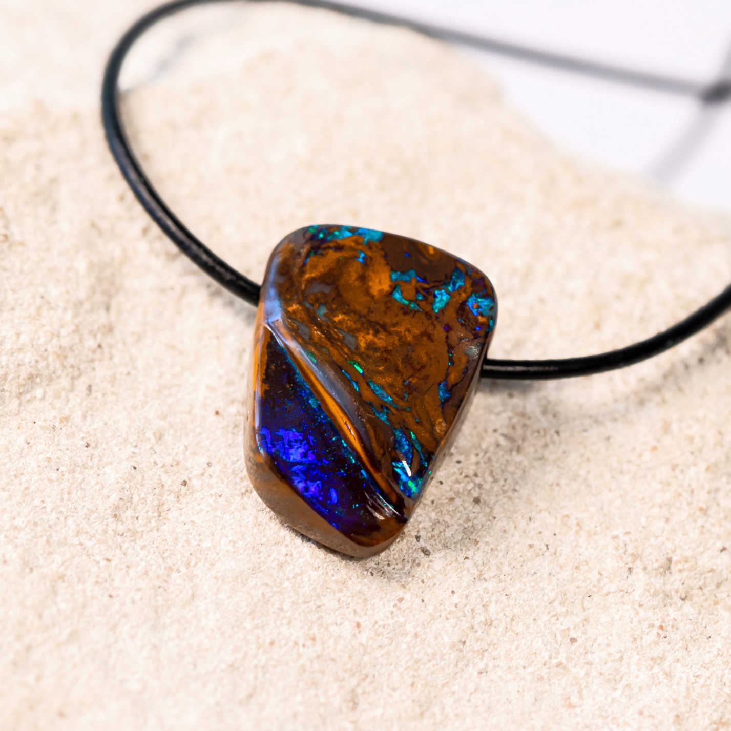 Boulder opal pendant from Australia with bright blue colour