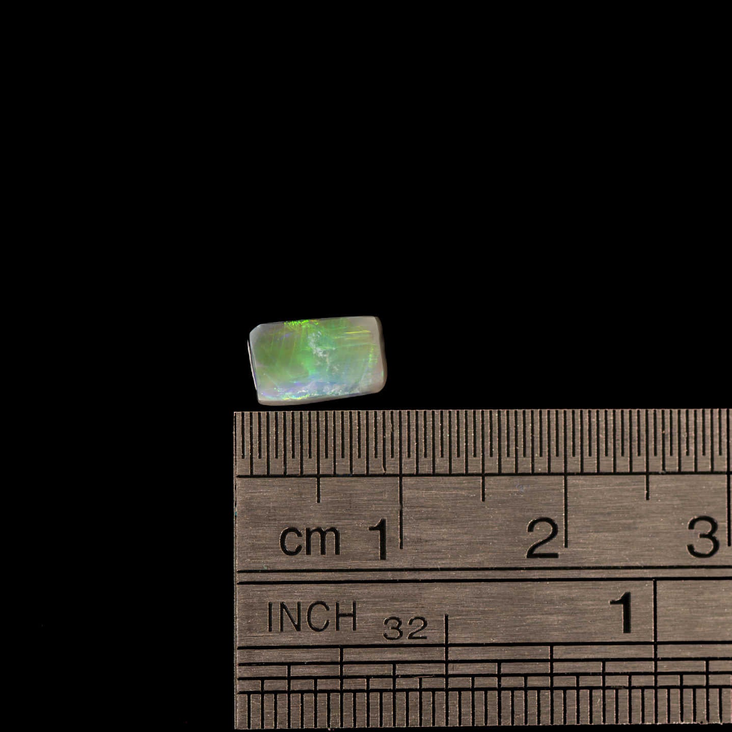 Lightning Ridge opal with dark body tone and striking neon green play-of-colour