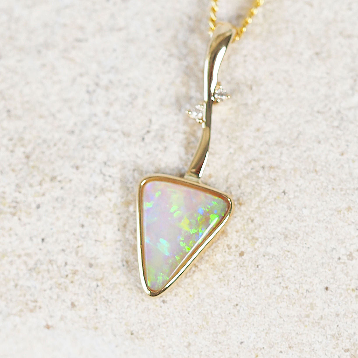 green and blue crystal opal triangular shaped pendant
