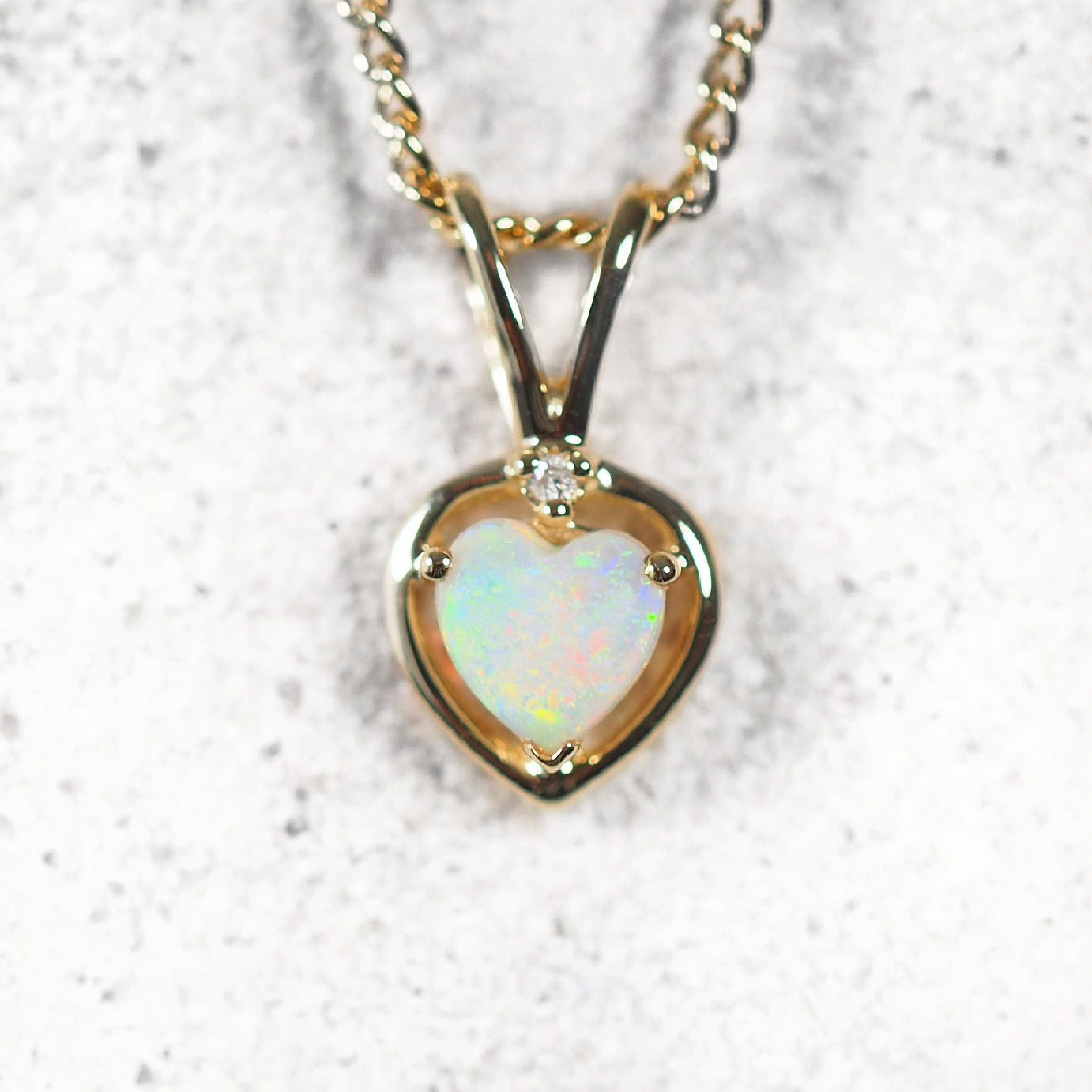 colourful opal pendant set in 9ct gold
