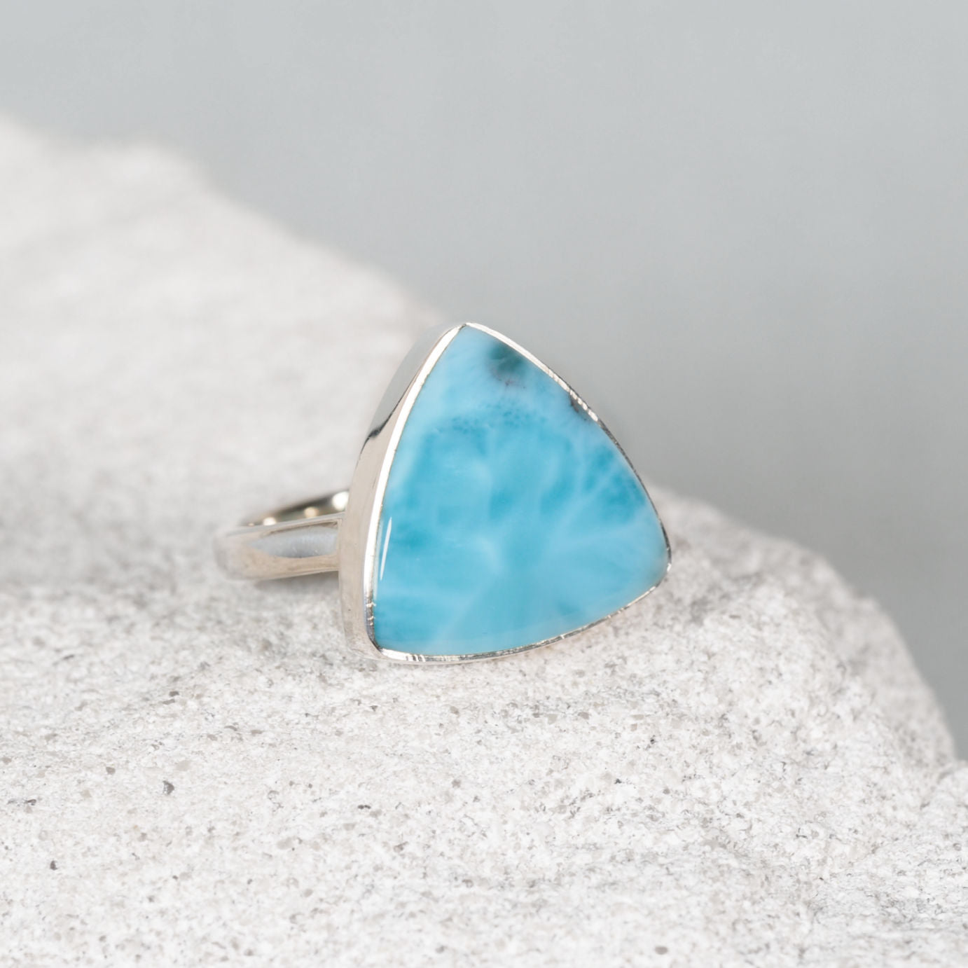 'Lucie' Silver Larimar ring in a silver frame holding the gemstone in place