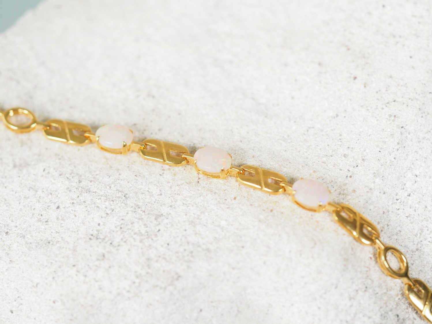 Fashionable white opal bracelet with three solid oval opals