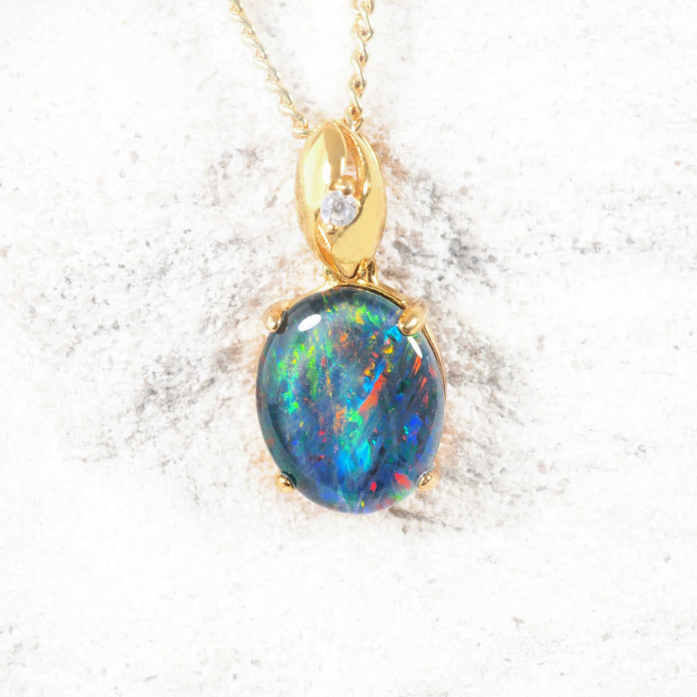 Serena opal pendant in gold-plated silver with claw-set oval Australian triplet opal and diamanté-accented bale