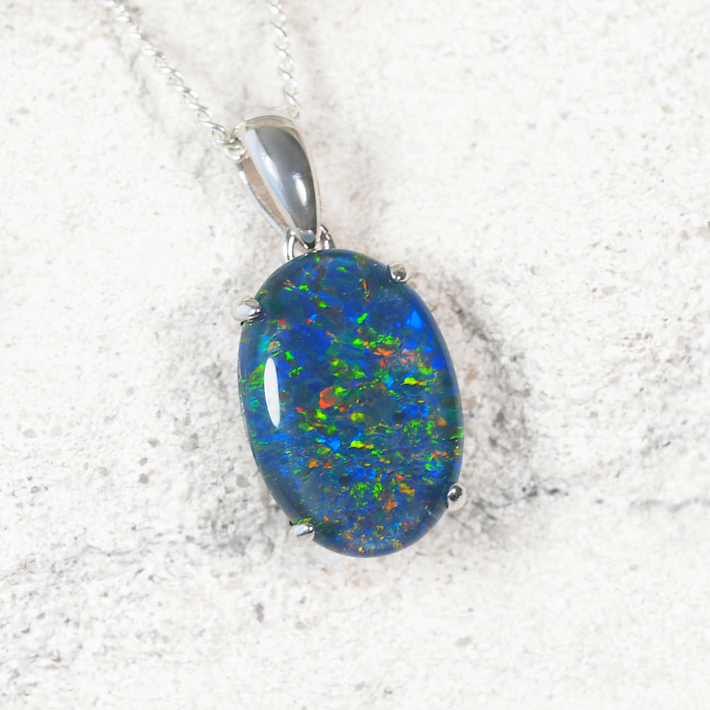 Elegant 'Classic Grande' opal necklace pendant in sterling silver featuring multi-coloured Australian triplet opal with complimentary silver-plated chain