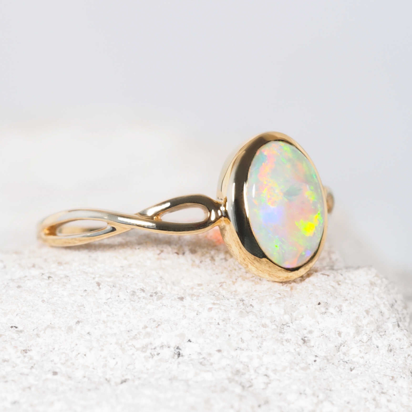 Australian solid opal ring with shimmering hues of green, pink and blue