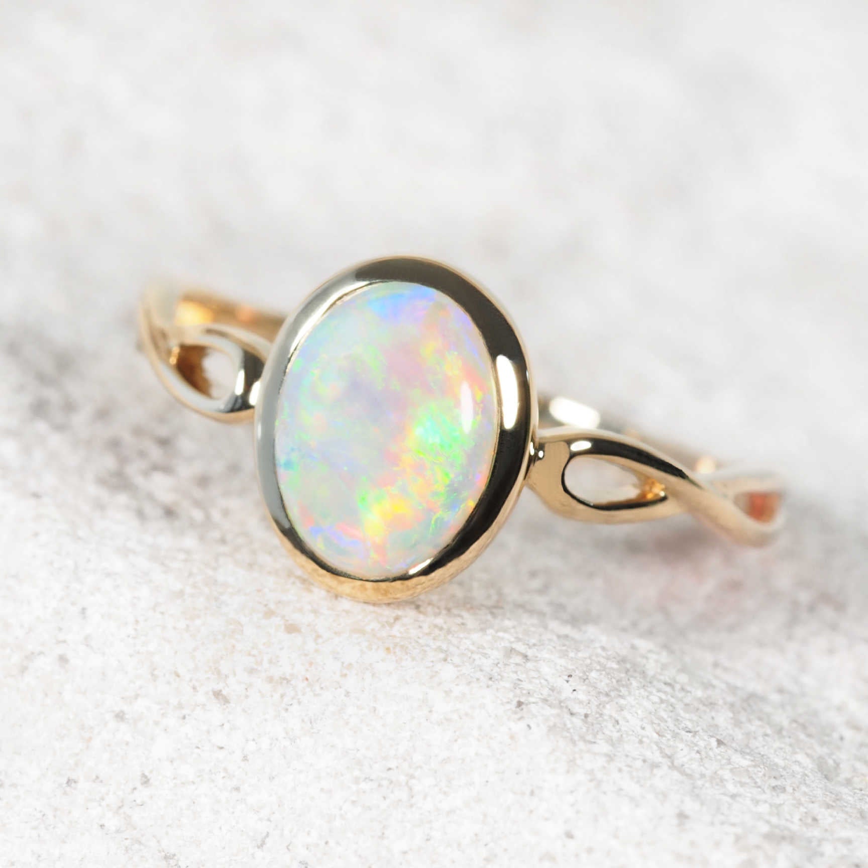 Alisa crystal opal ring in 14ct yellow gold with multicolour Coober Pedy opal