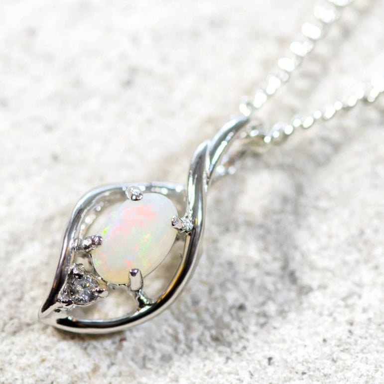 opal pendant set in silver with one diamante