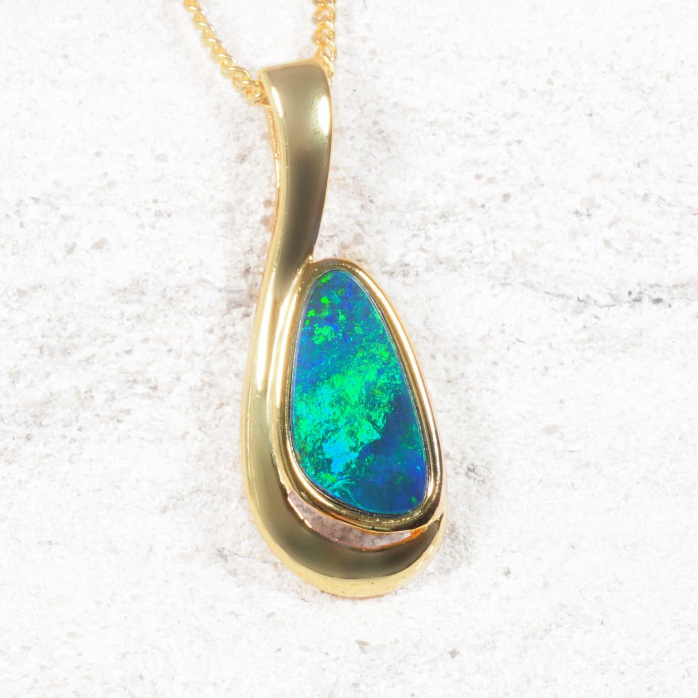 green opal pendant set in gold plated silver