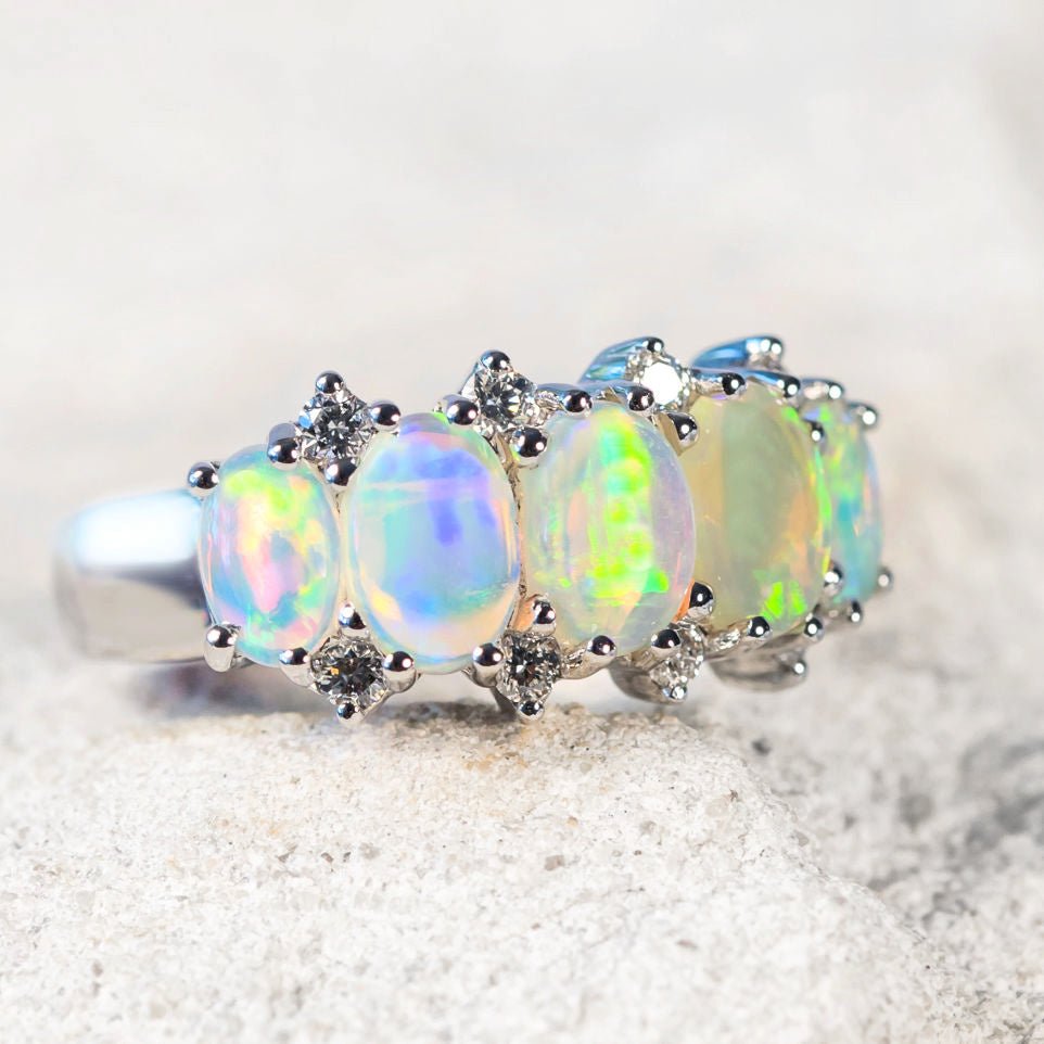 colourful opal ring with diamonds set in white gold