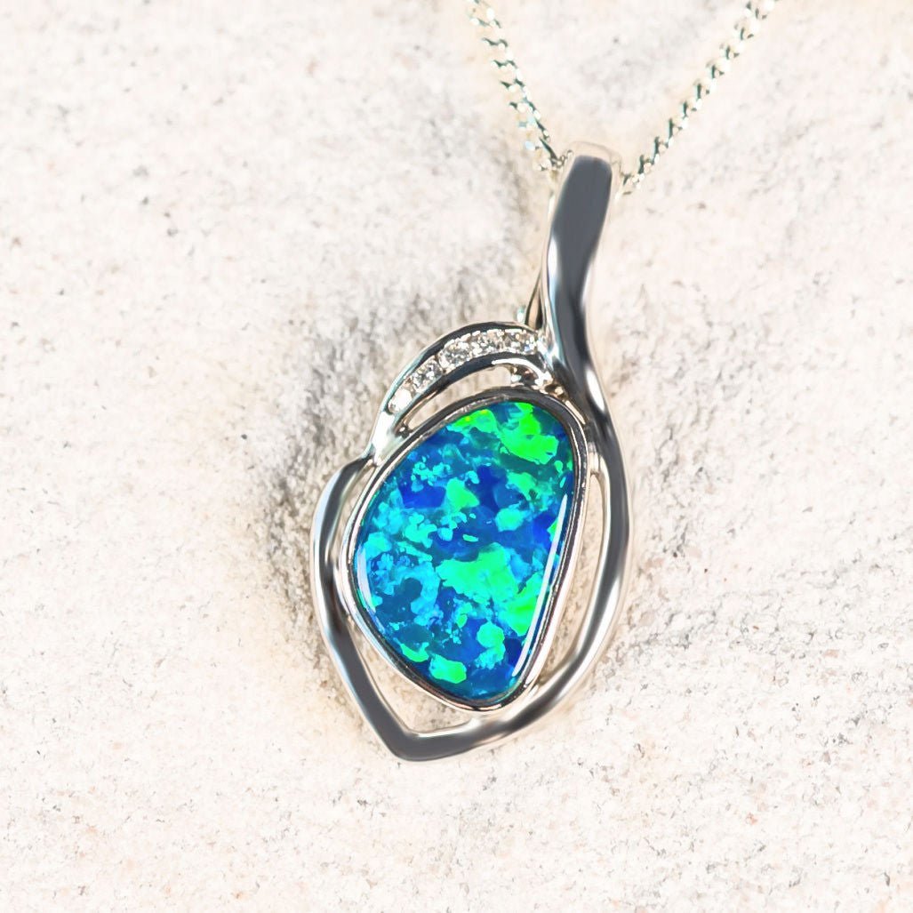green and blue white gold opal pendant with diamonds