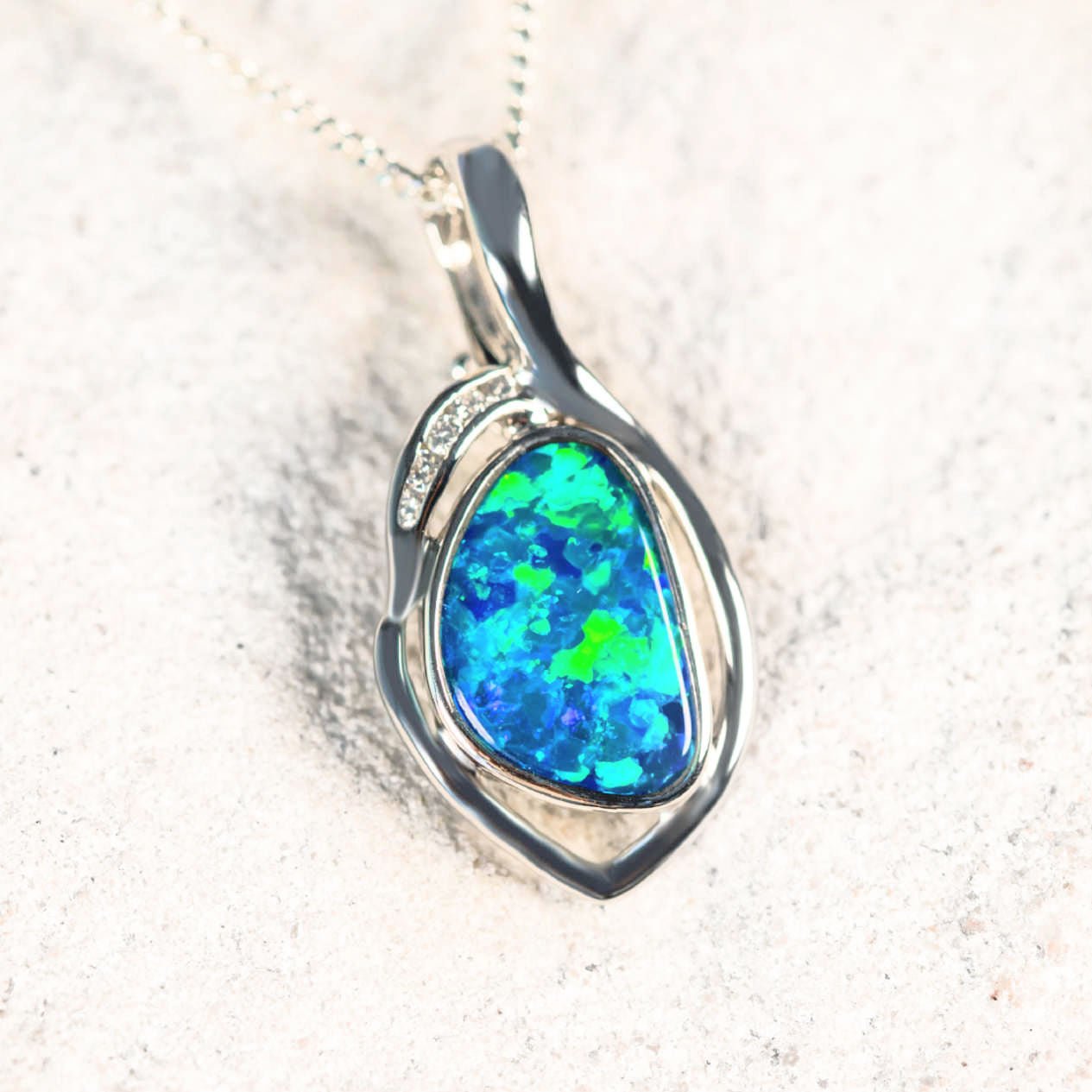 diamond and opal white gold pendant