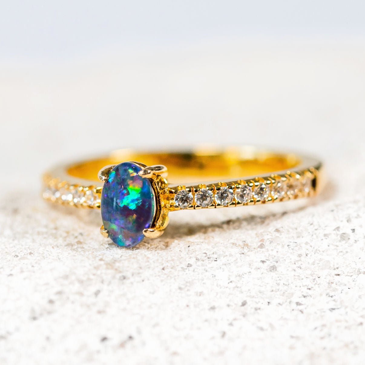 opal ring with 16 crystals set in gold plated silver