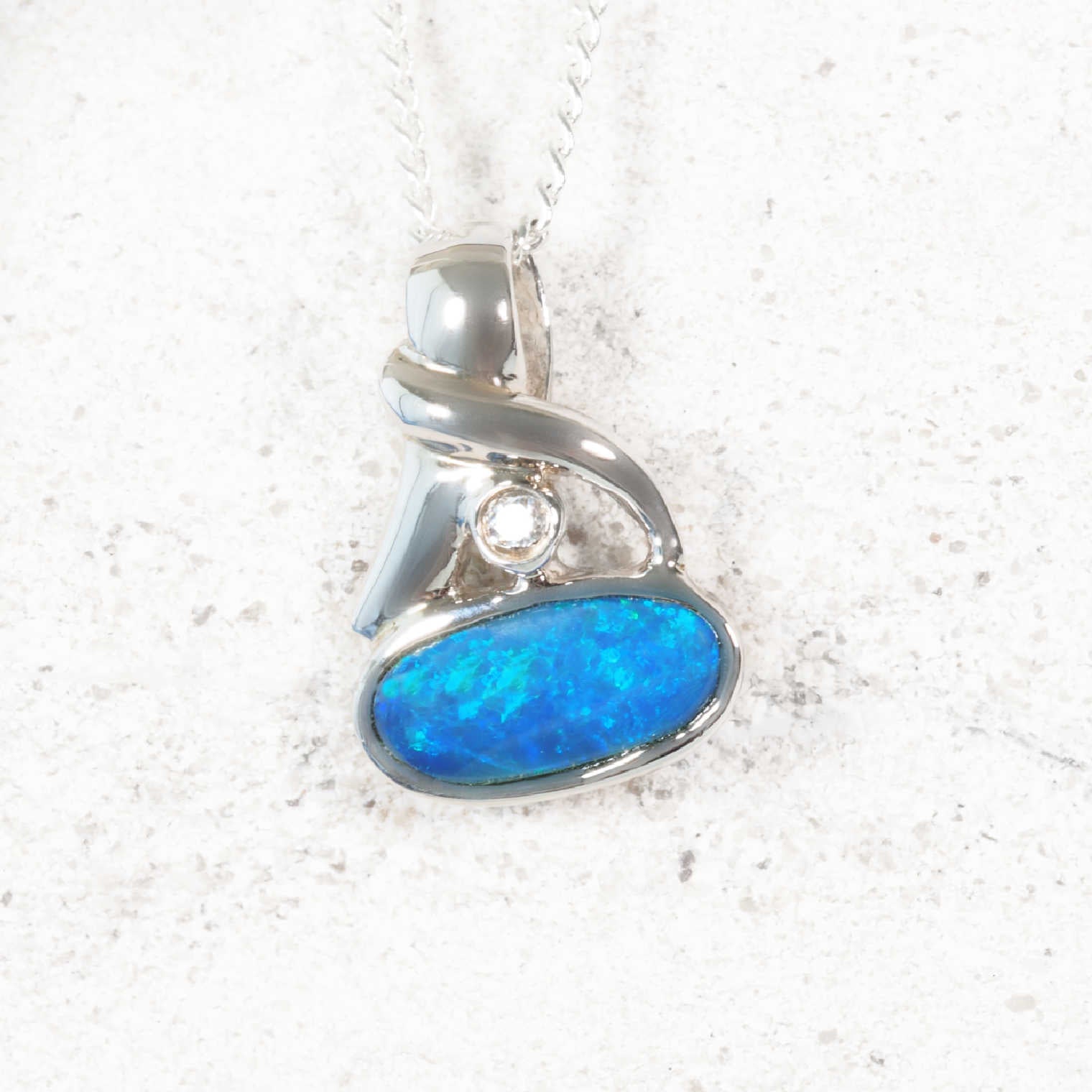 ‘Amirae’ sterling silver opal pendant with oval blue Australian doublet opal and crystal accent