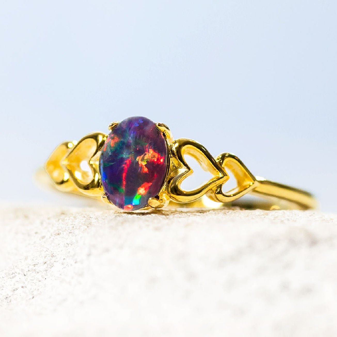 gold plated silver opal ring with a love heart design