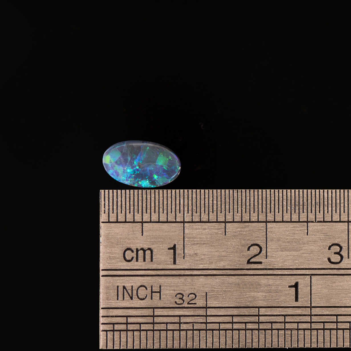 Green speckled black opal gemstone for bespoke jewellery designs