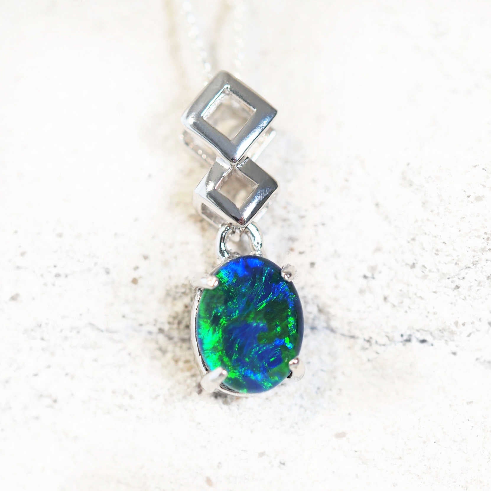 blue and green opal pendant set in sterling silver
