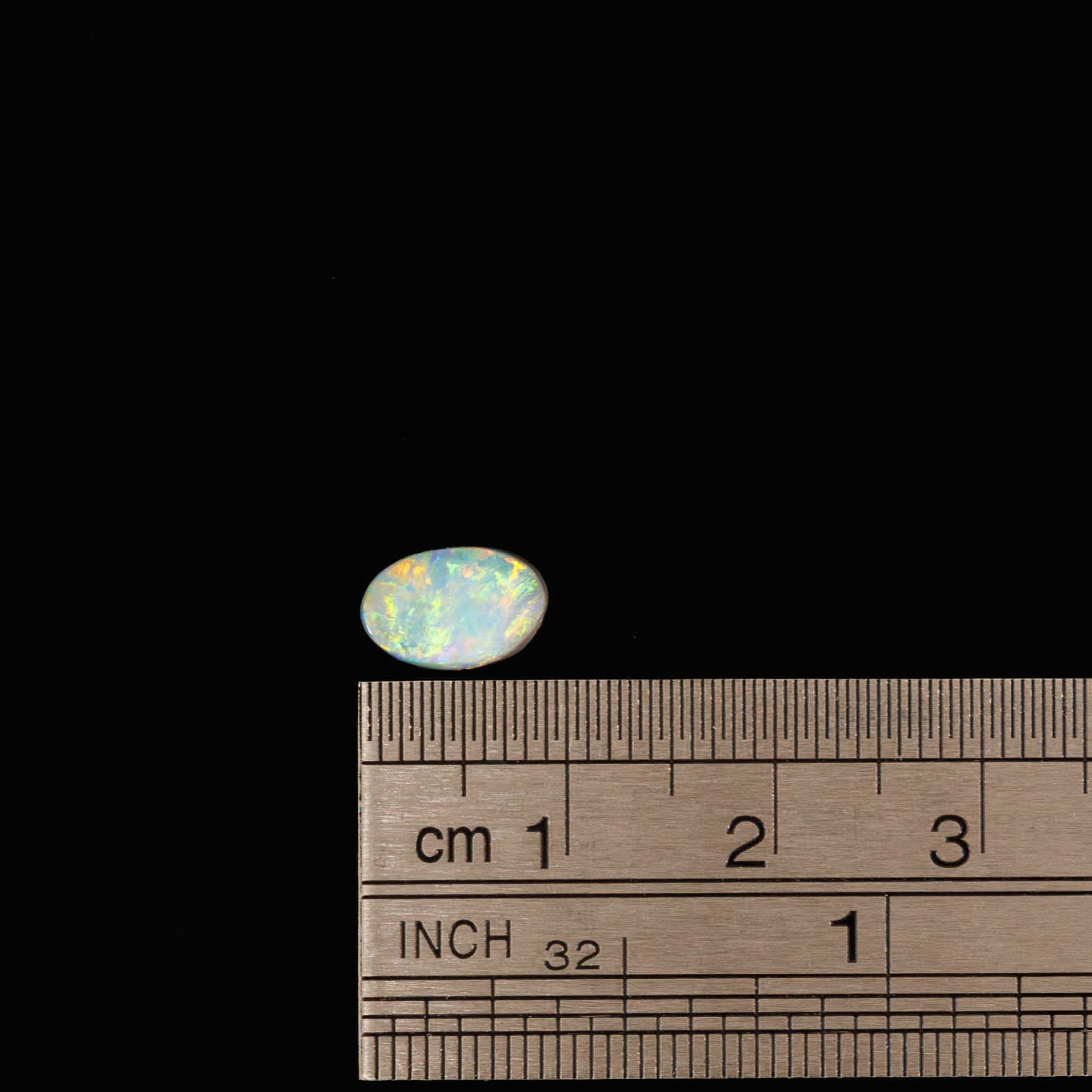thically sourced black opal featuring intense red fire and shimmering green-blue highlights