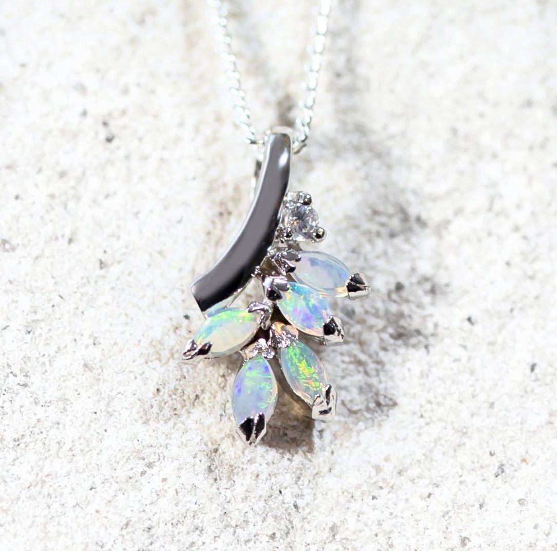 close up of opal pendant set in silver