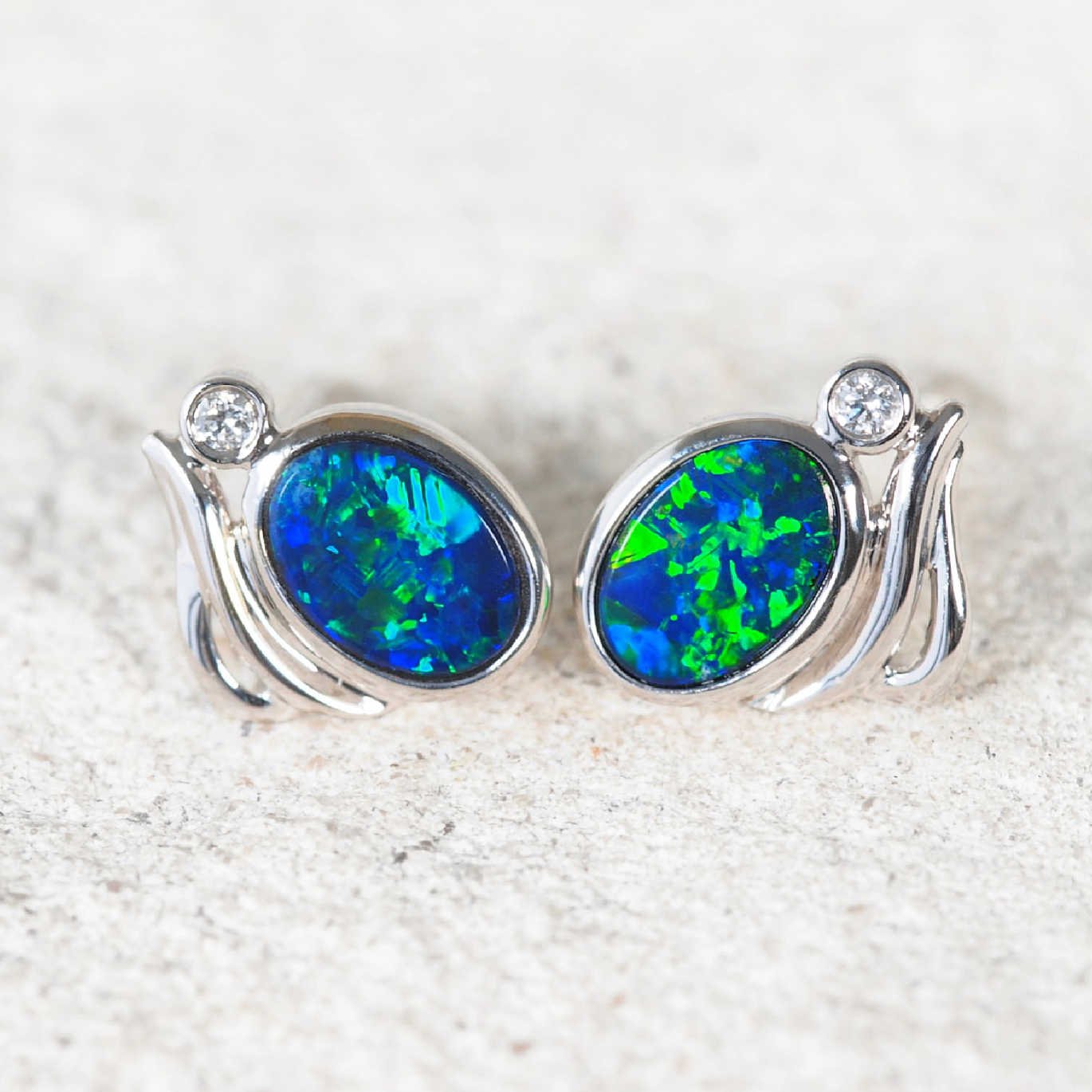 Handcrafted Australian opal earrings in white gold with secure butterfly backings