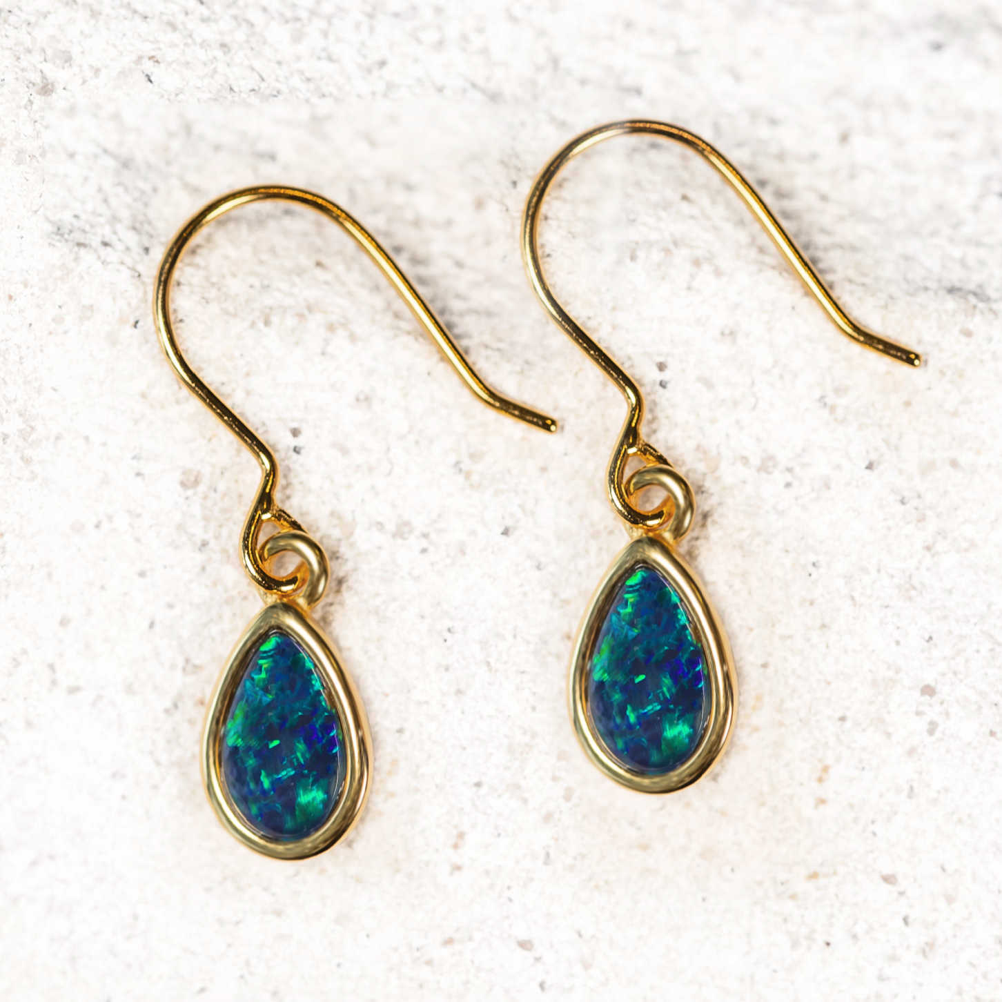 blue drop opal earrings set in gold plated silver