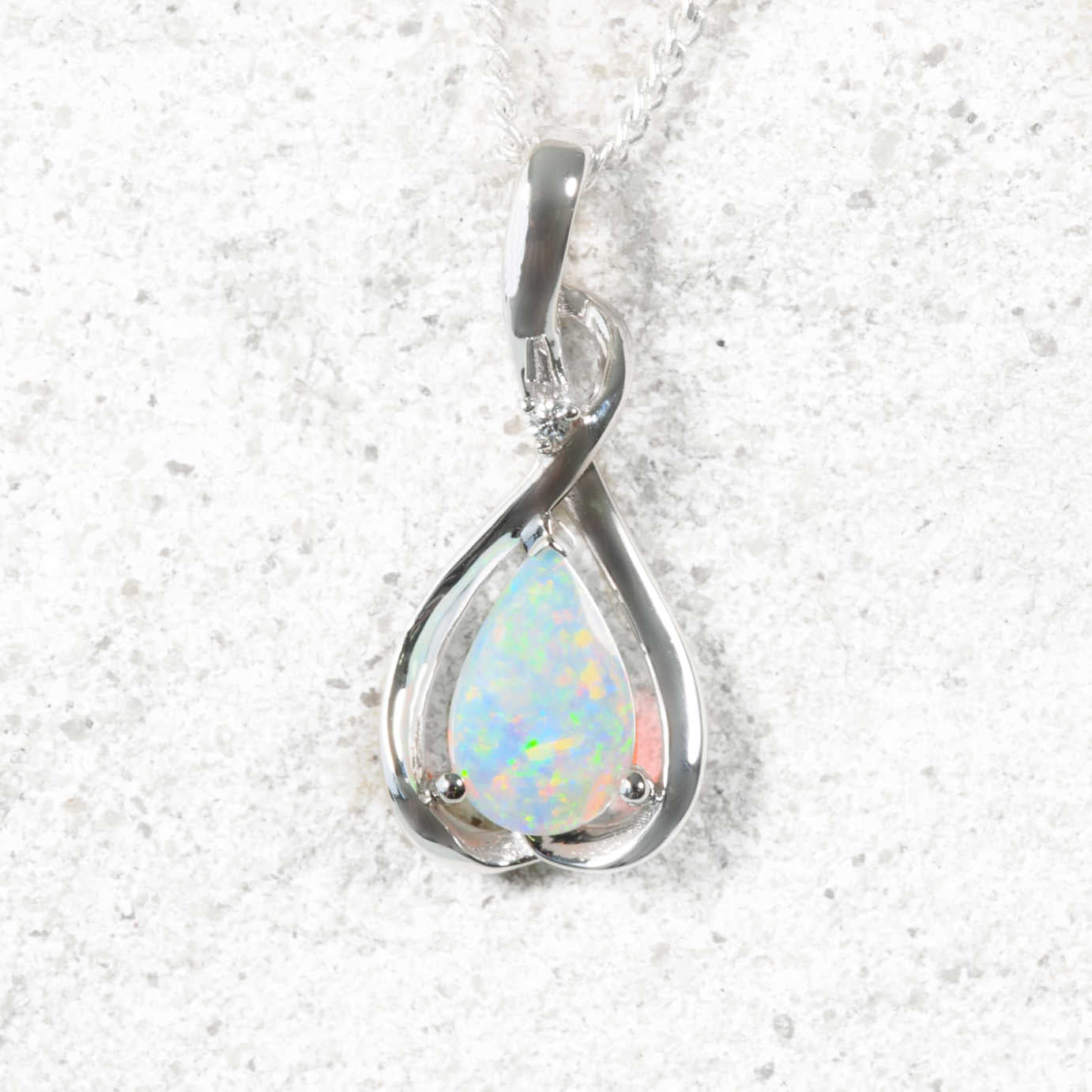 colourful opal pendant in white gold