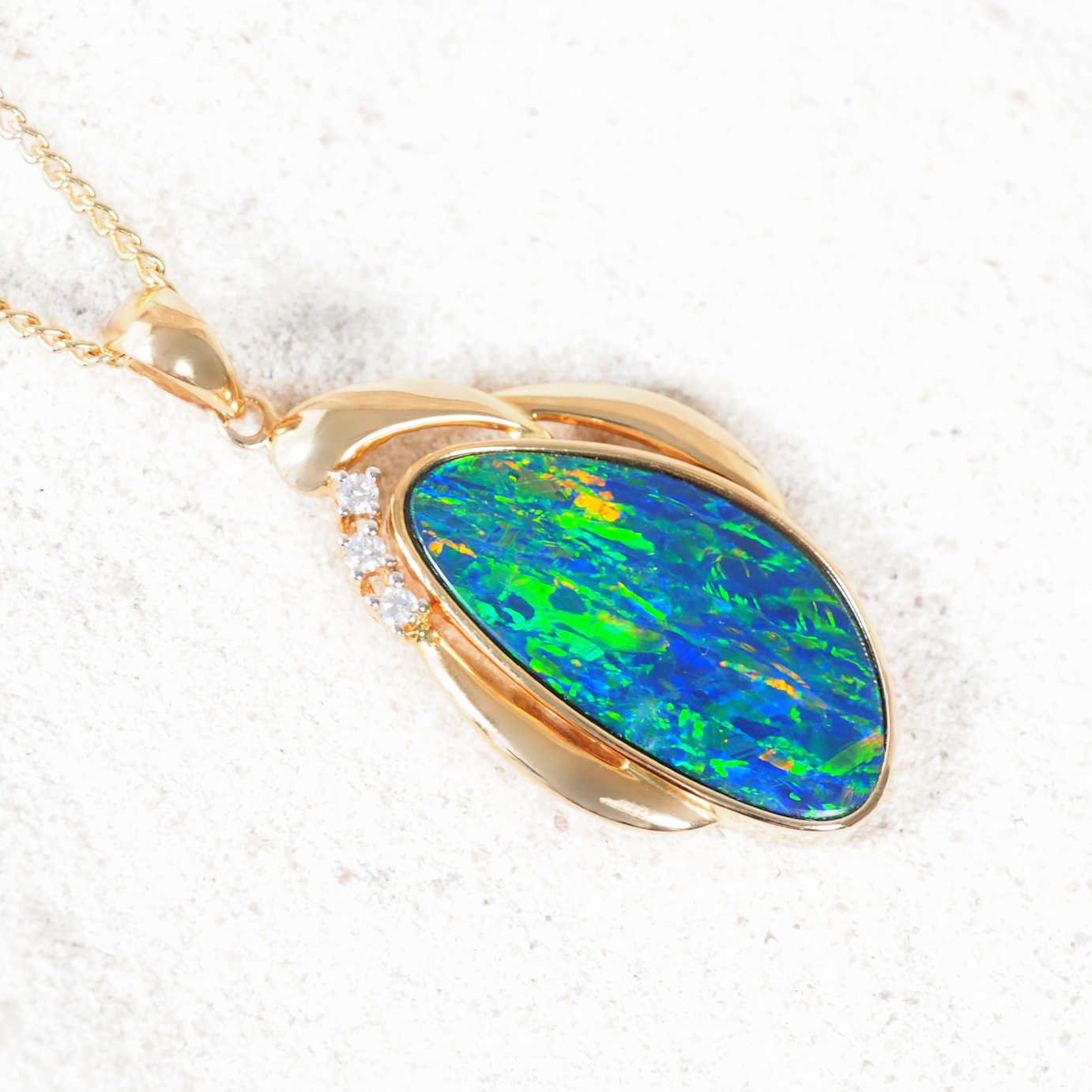 Elegant Australian doublet opal pendant with bezel setting and three white diamonds – ‘Camille’ by Black Star Opal