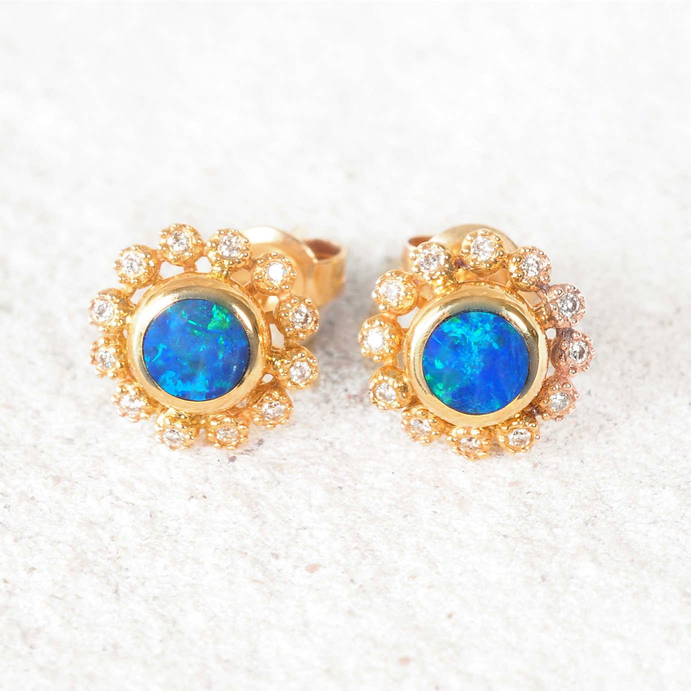 14ct yellow gold stud opal earrings with round blue-green Australian doublet opals and diamond halo