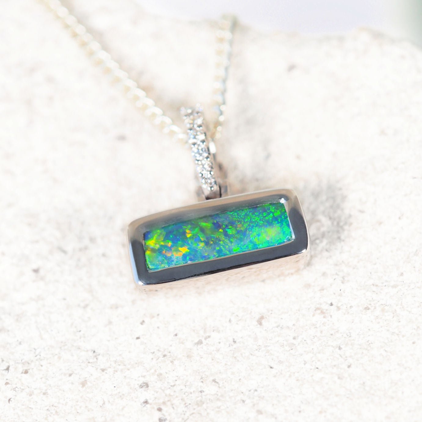 ‘Cassidy’ 14ct white gold black opal pendant – rectangular Lightning Ridge opal with diamond enhancer clasp by Black Star Opal