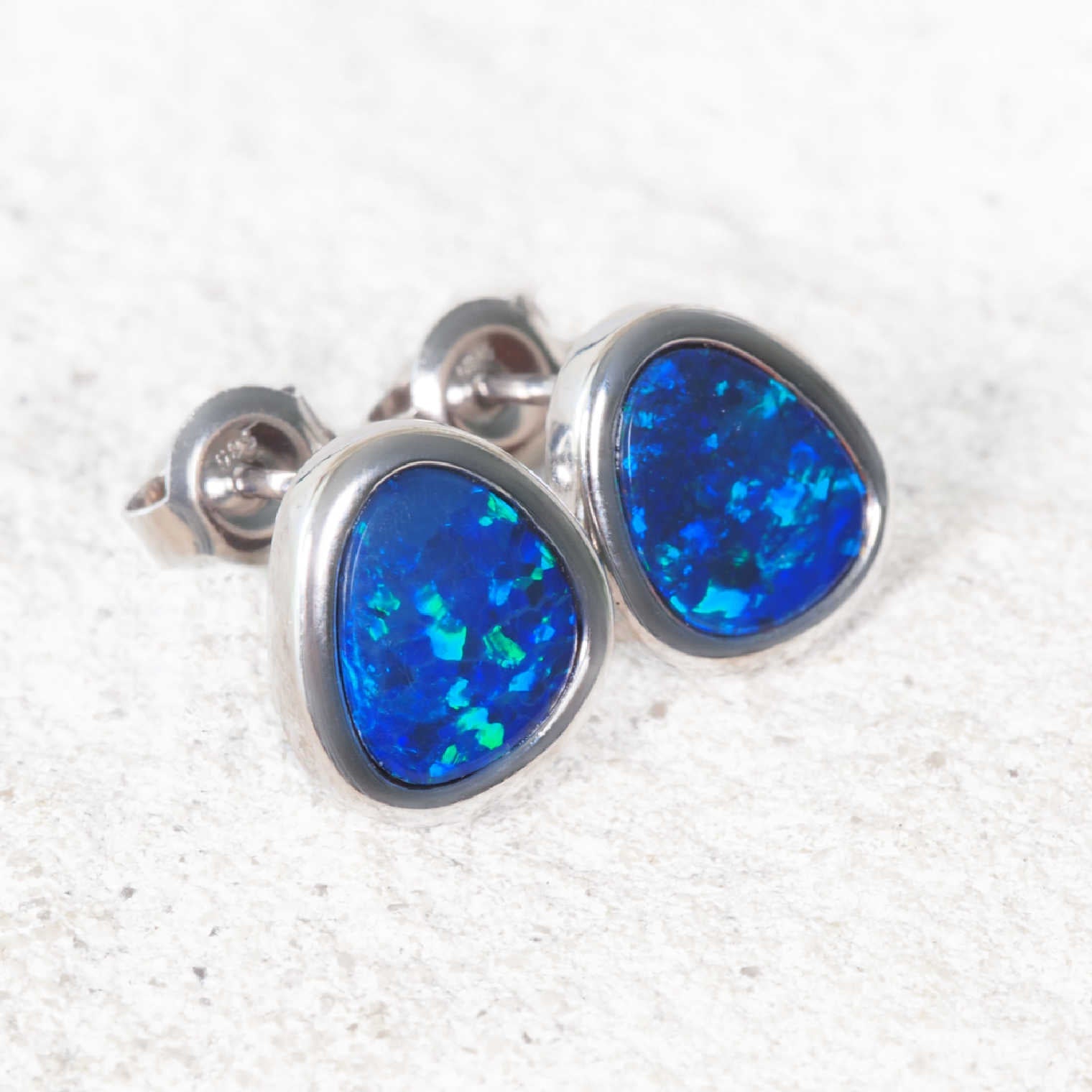 Australian blue and green opal earrings in white gold