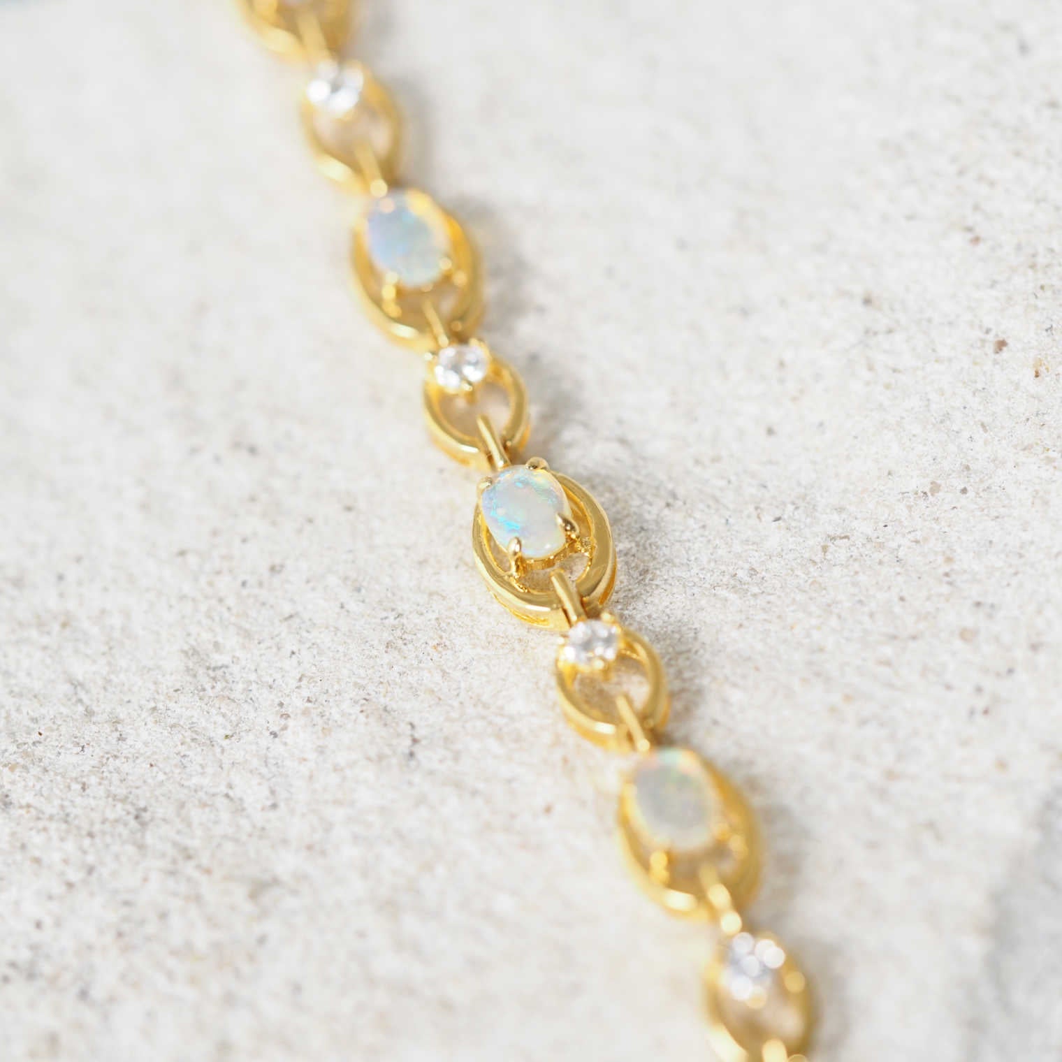 crystal opal bracelet with gold plated silver setting