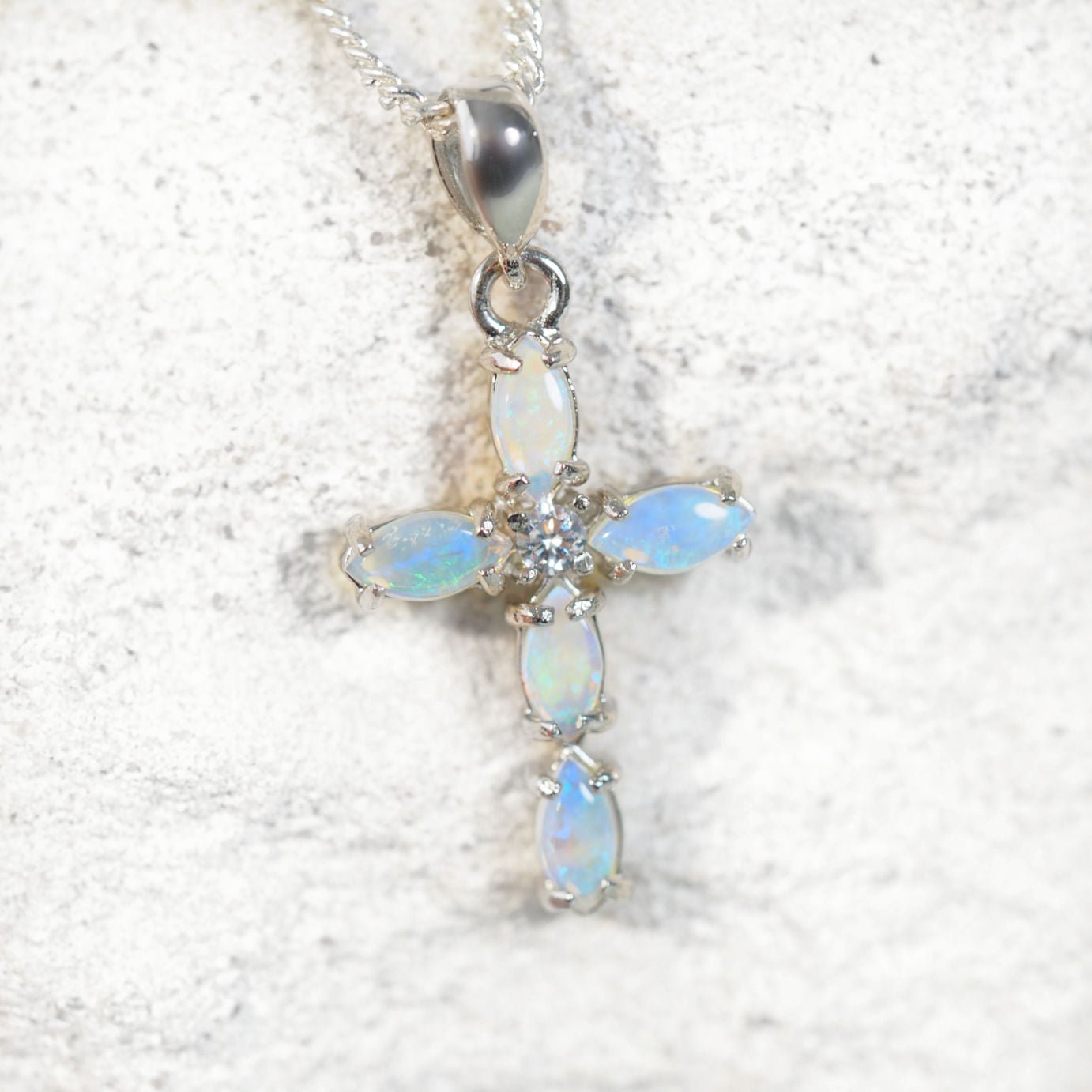 Blue pal cross pendant on a white background