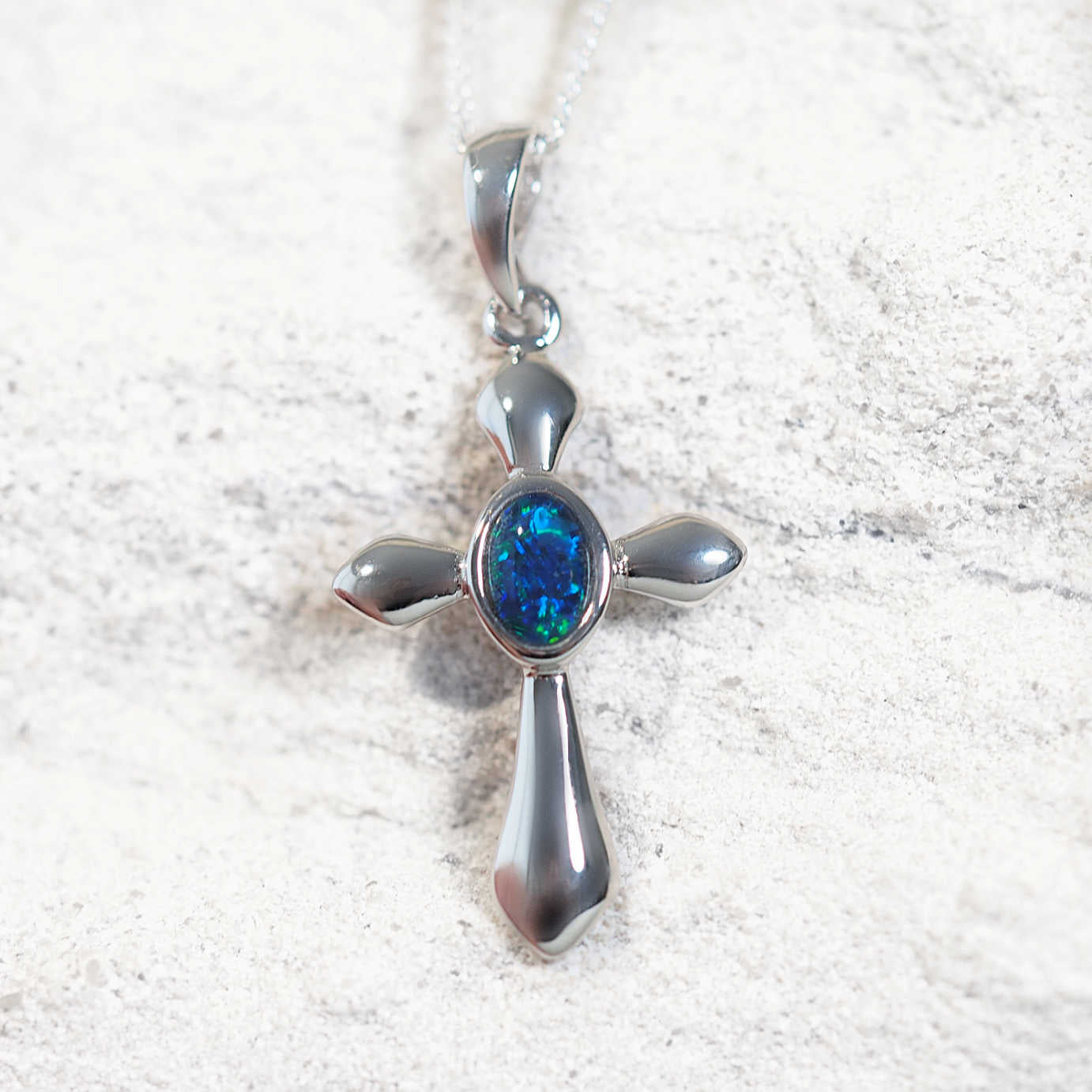 Sterling silver crucifix necklace pendant featuring Australian triplet opal with radiant blue-green play-of-colour