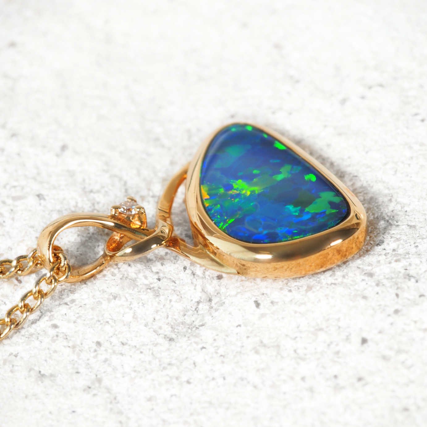 'Daria' opal and diamond pendant in 14ct gold with vivid Australian doublet opal
