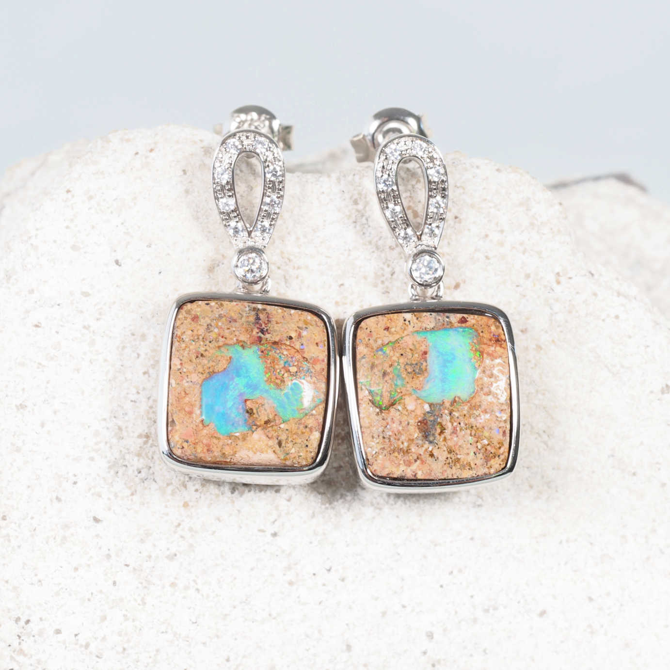 blue and green boulder opal earrings set in sterling silver