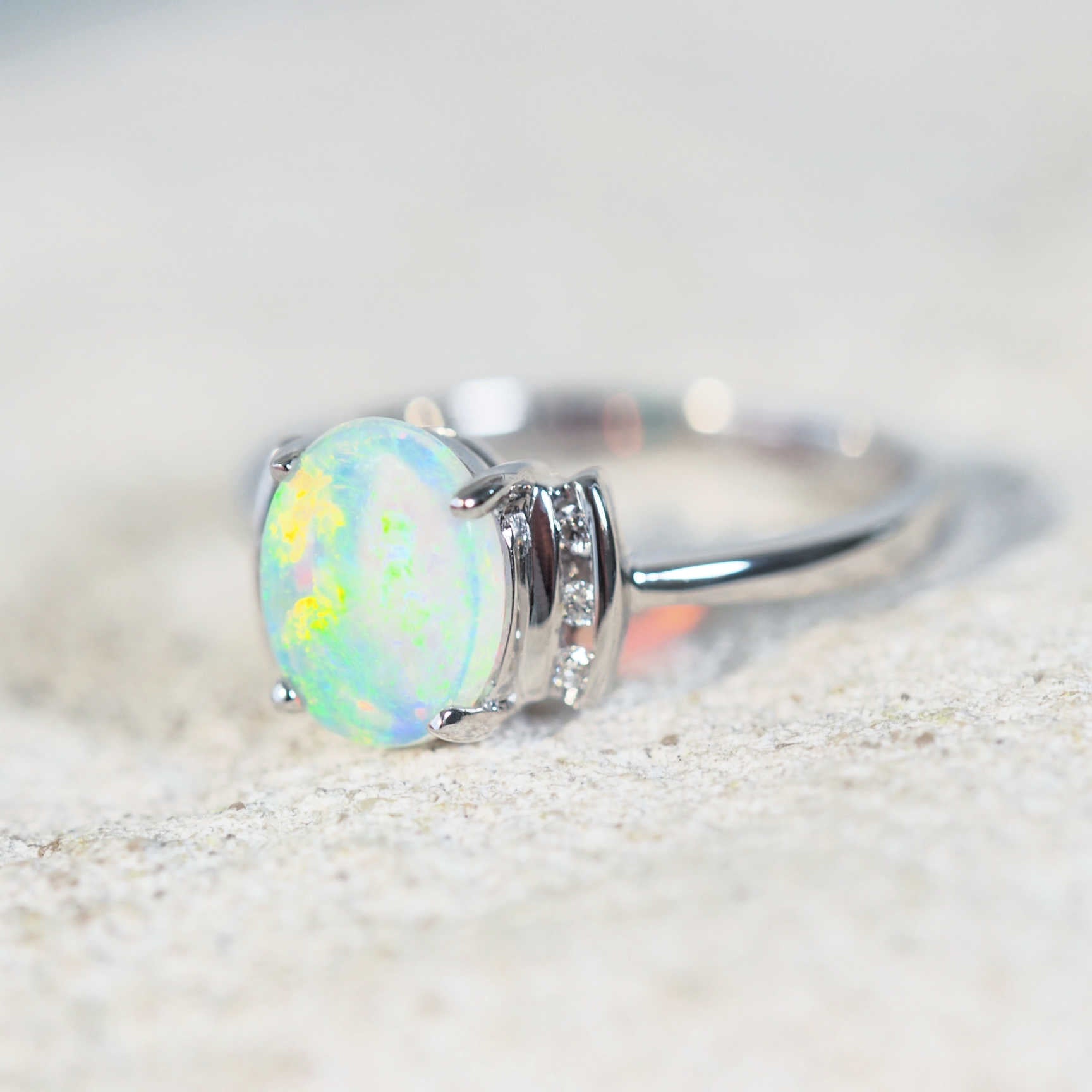 green crystal opal ring set in 14ct white gold