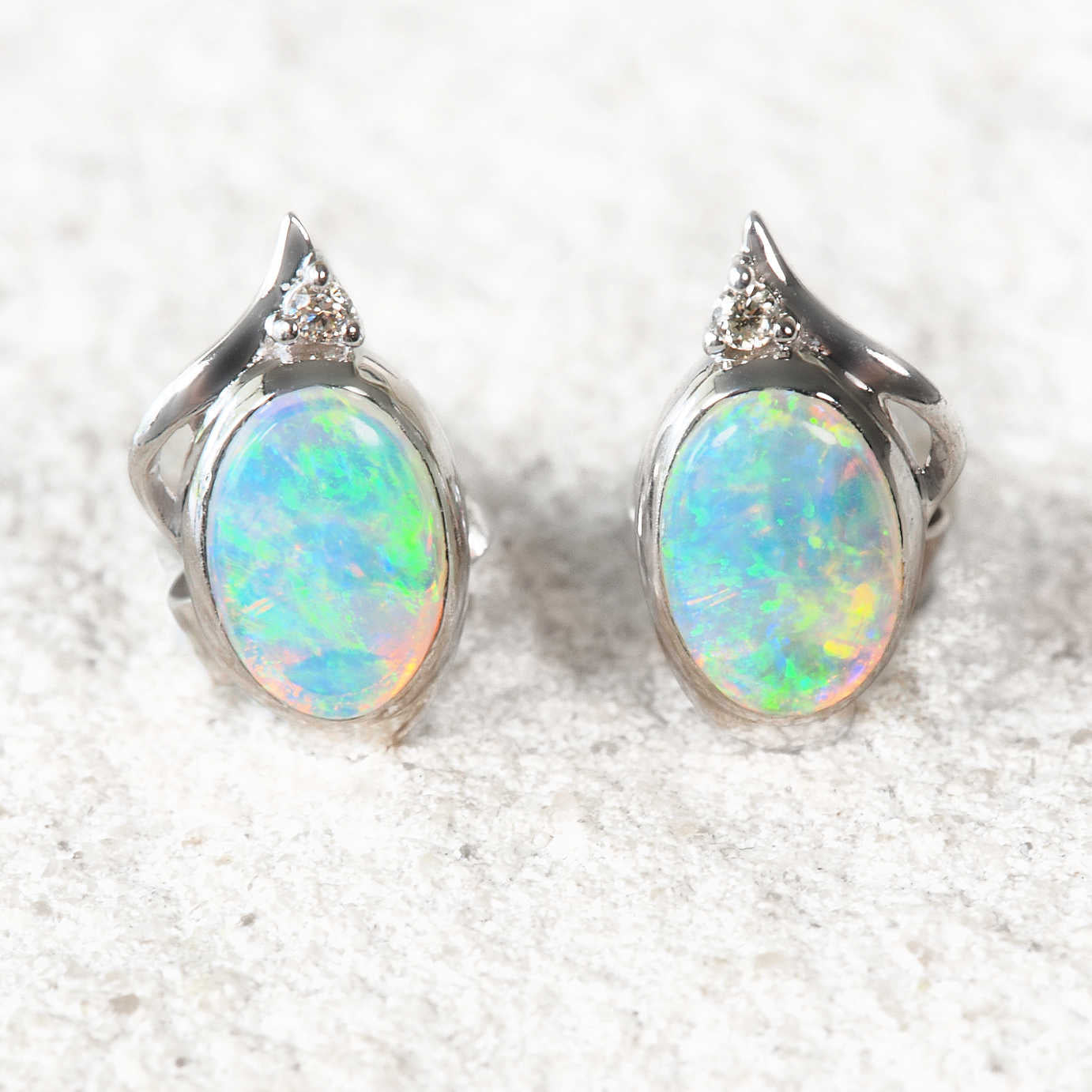 green opal earrings set in white gold with diamonds