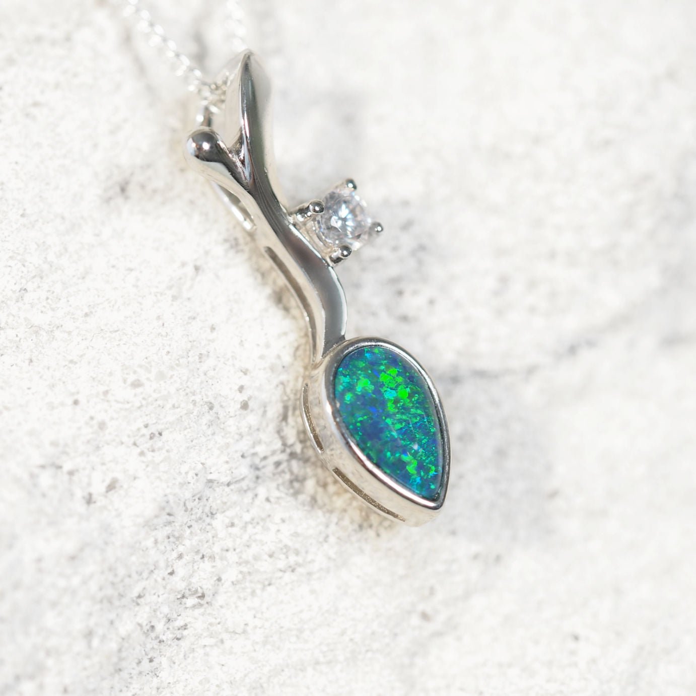 Sterling silver decorative necklace pendant featuring blue-green Australian triplet opal with sparkling diamanté