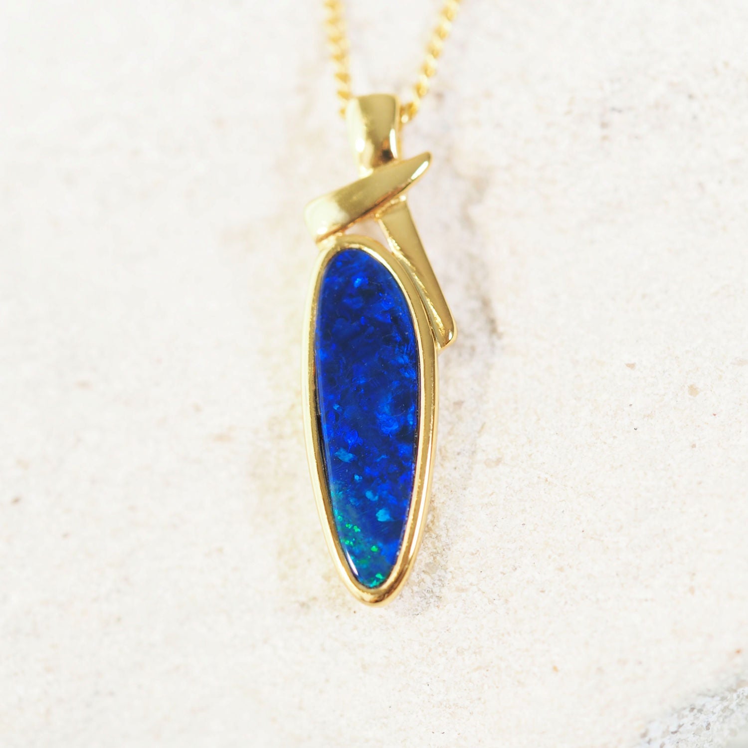 blue and green opal pendant set in gold plated silver
