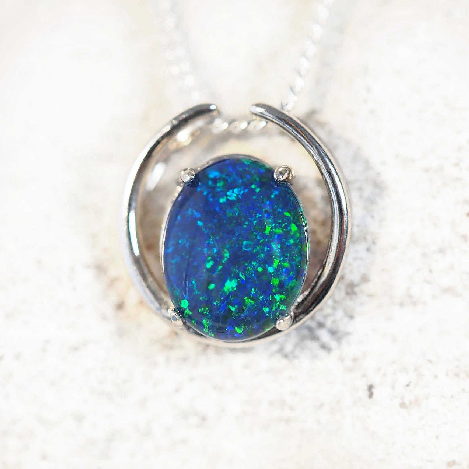 blue and green oval opal pendant in silver