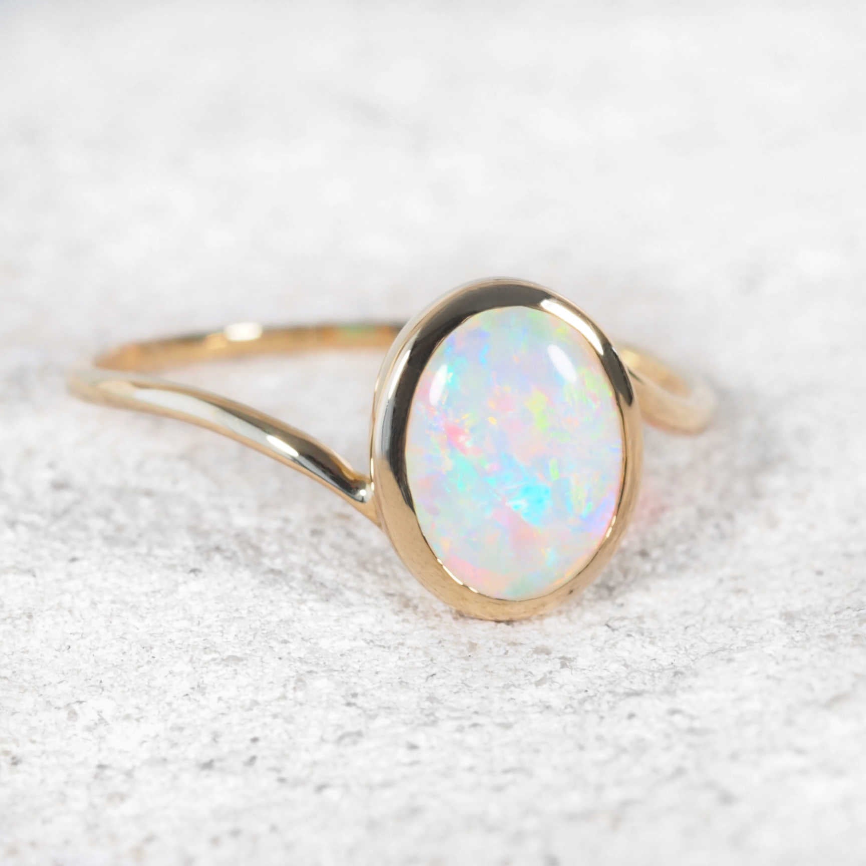 Luxury opal engagement ring handcrafted in yellow gold from Black Star Opal