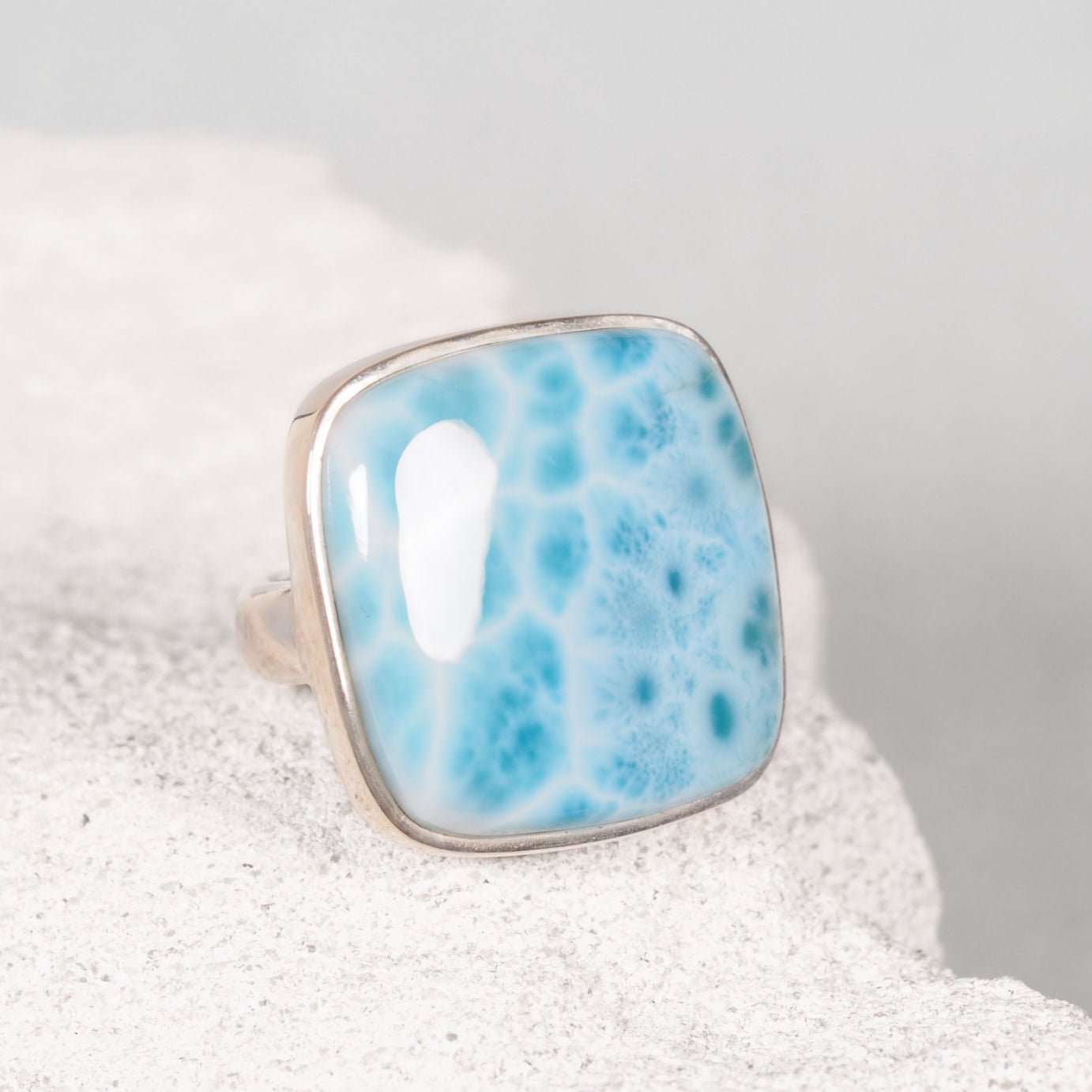 The ‘Elara’ silver ring with a square Larimar cabochon in soft blue and white marbled tones
