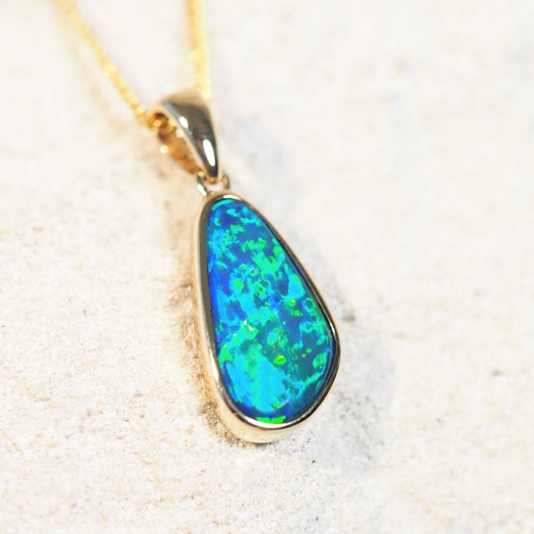 blue and green doublet opal gold necklace