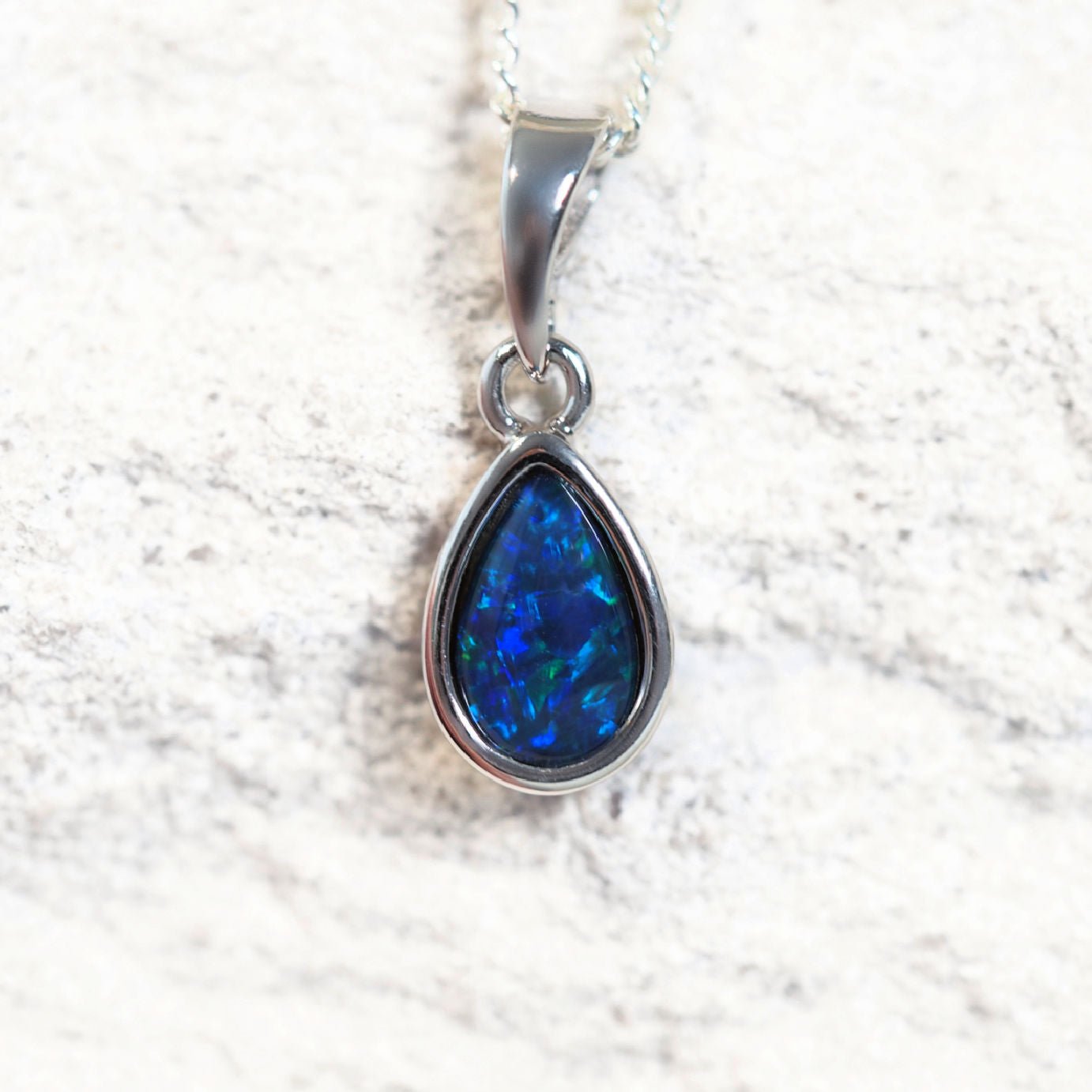 'Ella Blue' opal pendant in sterling silver with bezel-set teardrop Australian triplet opal in vivid blue and green tones
