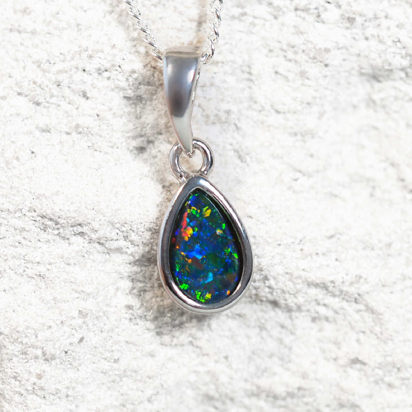 'Ella' opal pendant in sterling silver with bezel-set teardrop Australian triplet opal in vibrant multi-coloured tones