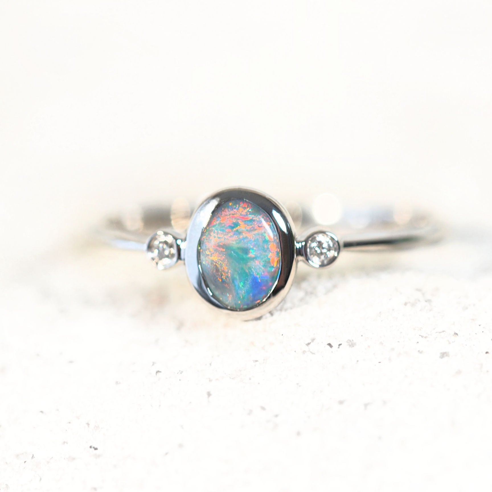 semi-black opal ring bezel set in 14ct white gold