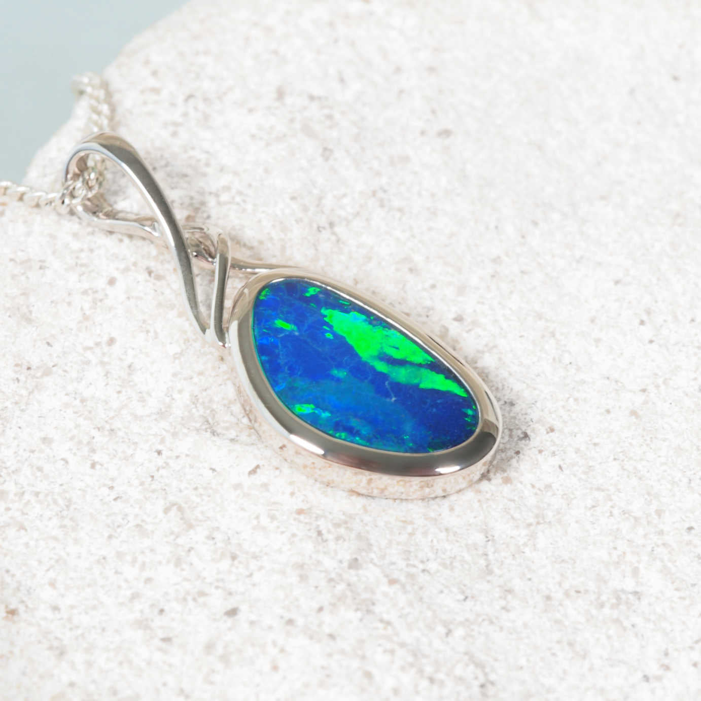 Blue and green opal necklace in polished white gold from Black Star Opal