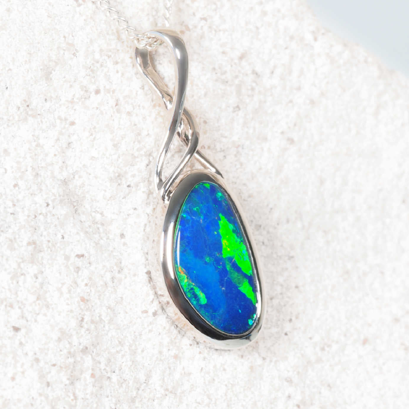 Australian doublet opal pendant with bezel setting in 14ct white gold