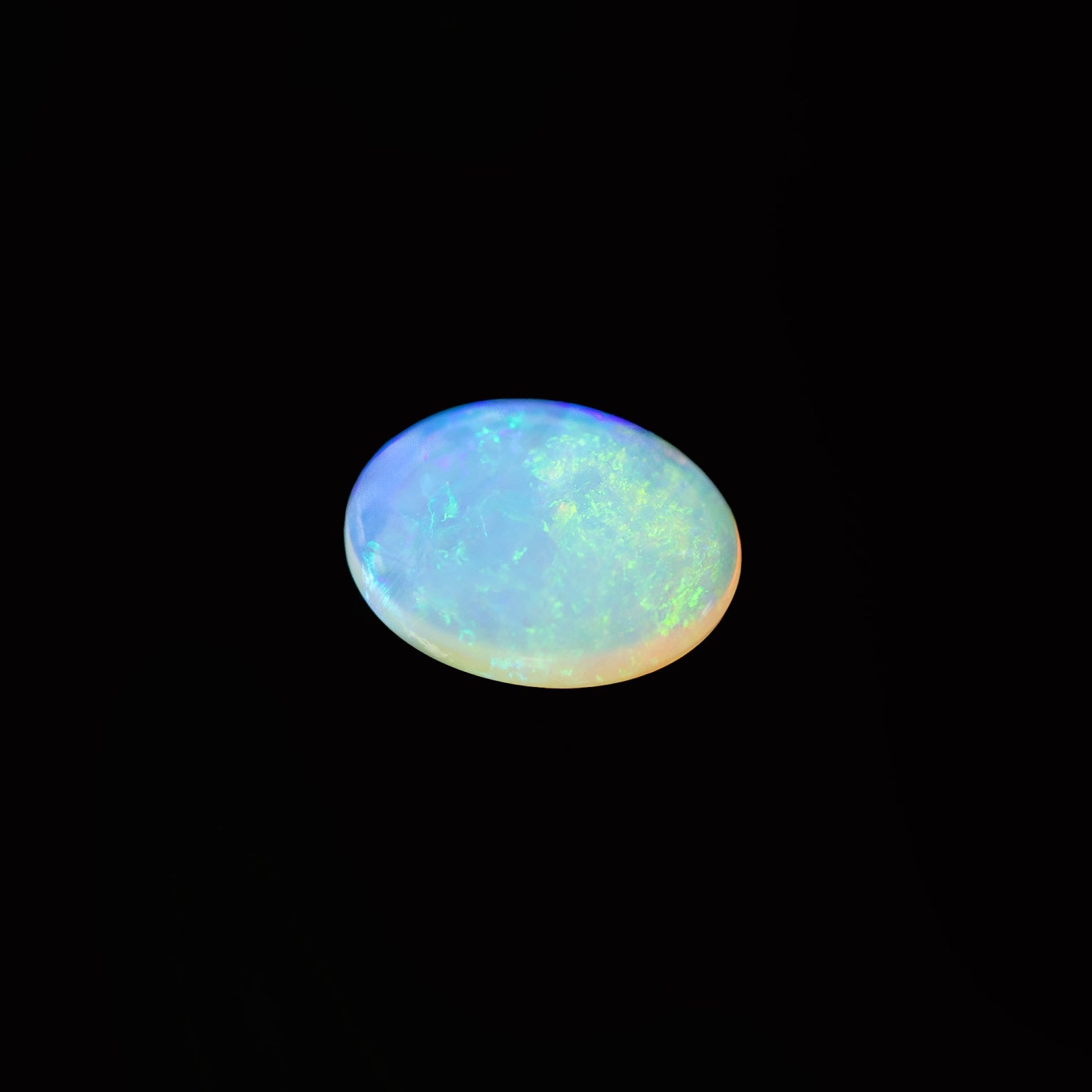 Crystal opal gemstone on a black background